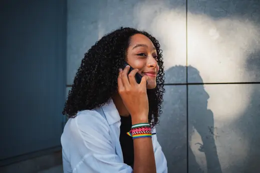 Professional using one smartphone for separate personal and business phone numbers